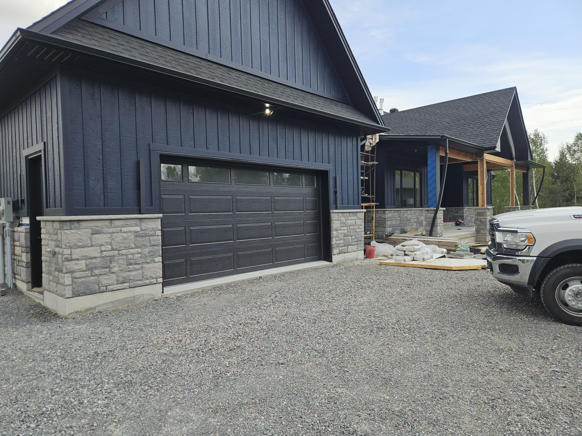 Dark home stone garage surround and columns, A1 Creative Masonry