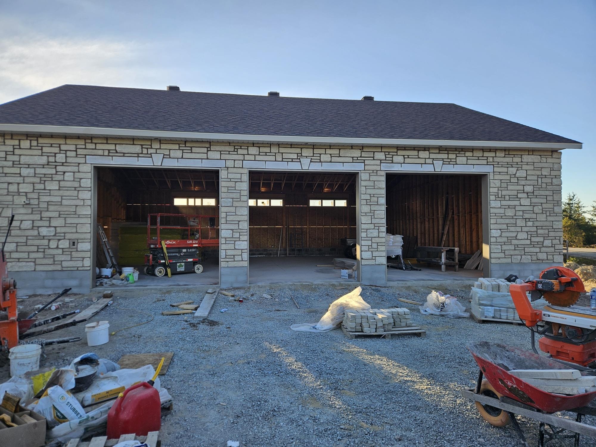 Stone veneer garage front elevation in progress, A1 Creative Masonry