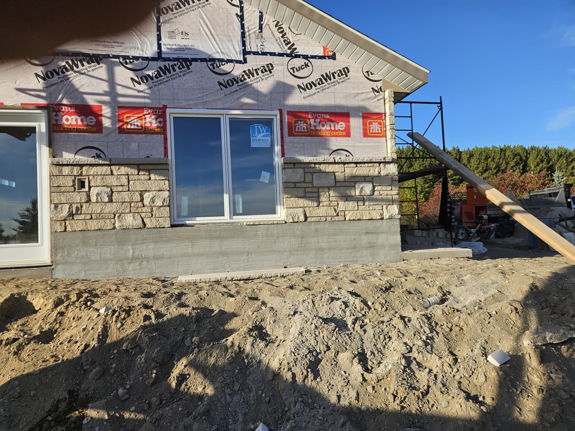 Stone veneer entry and window surround in progress, A1 Creative Masonry